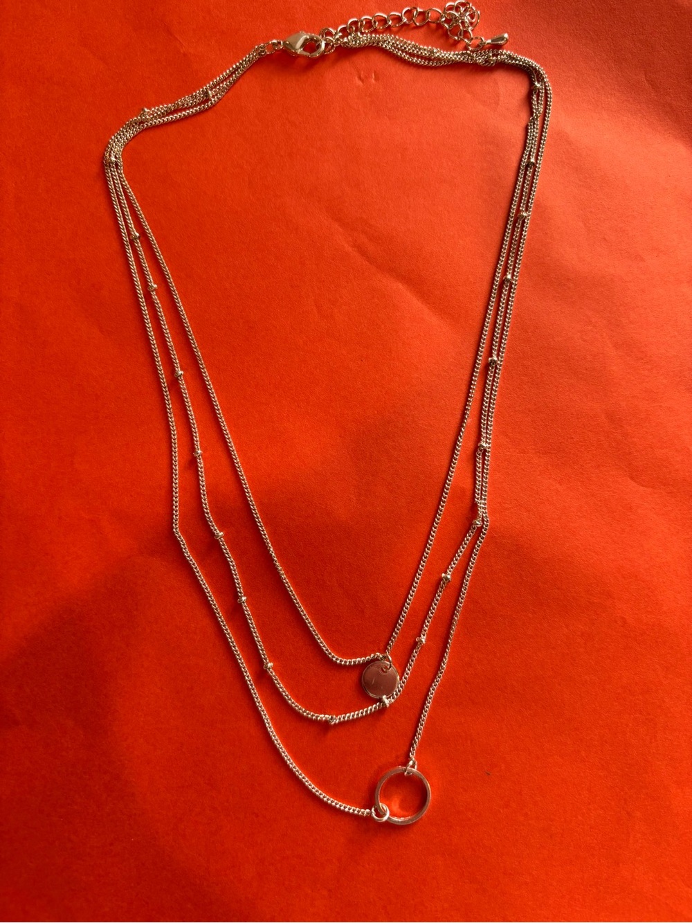 Layered Silver Multi-Chain Necklace with Ring and Disc Pendant